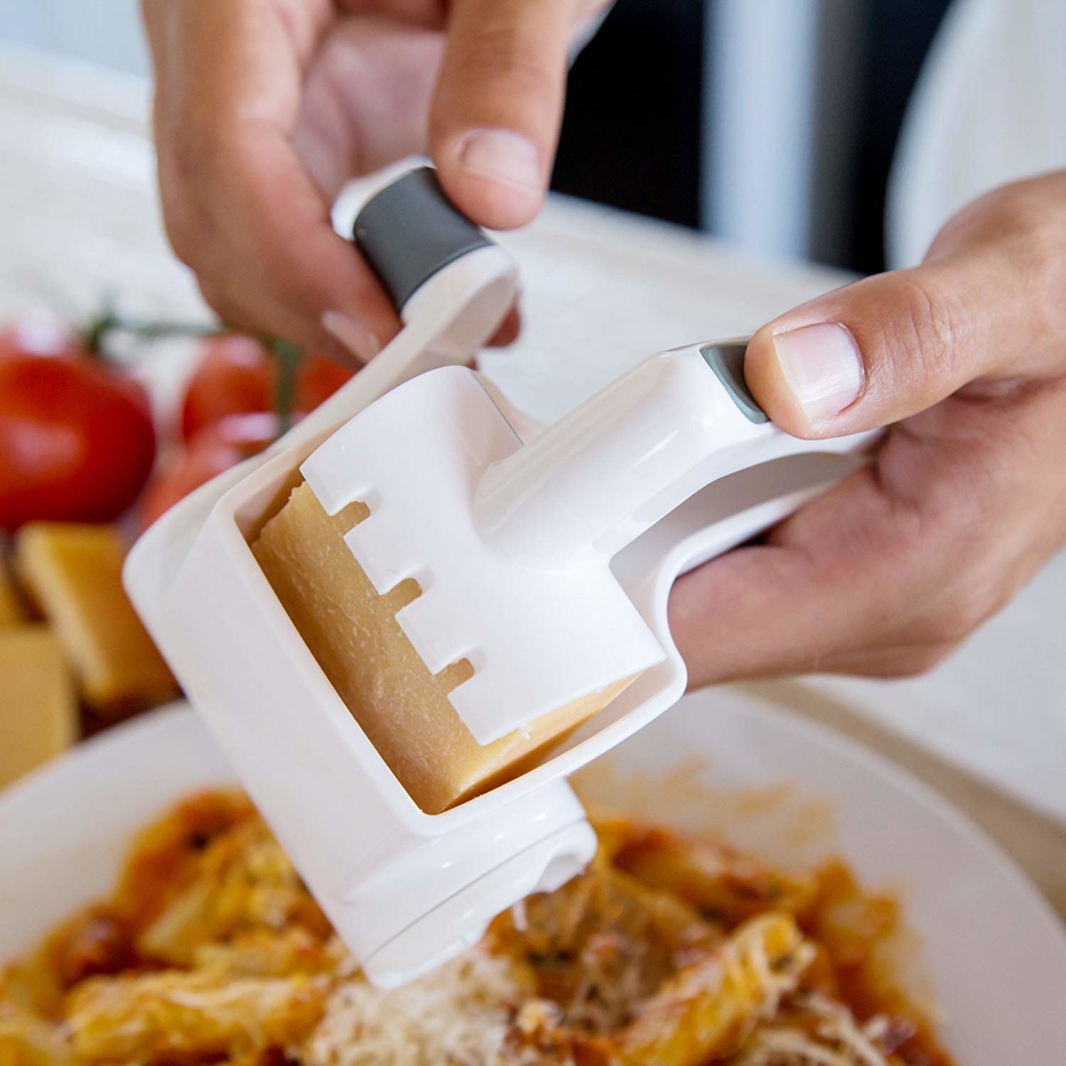 A model using the grater to put cheese on pasta