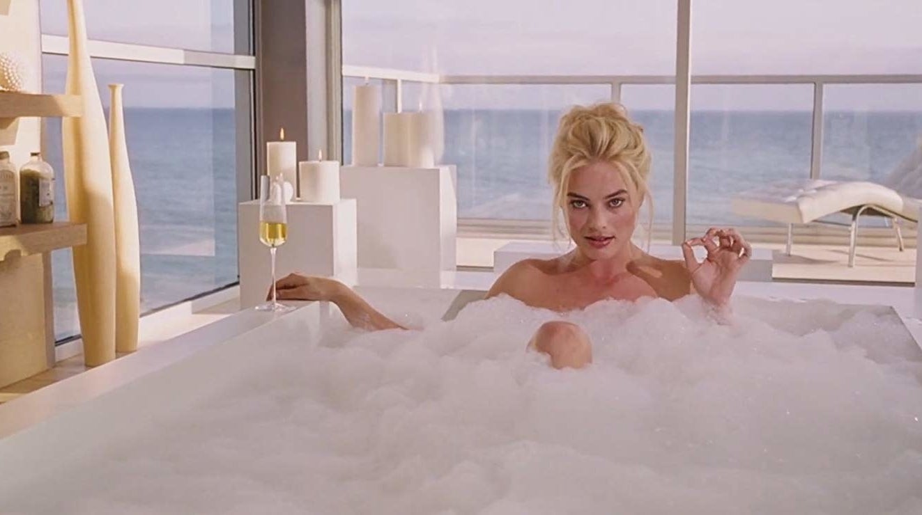 Margot Robbie sits in a bubble bath