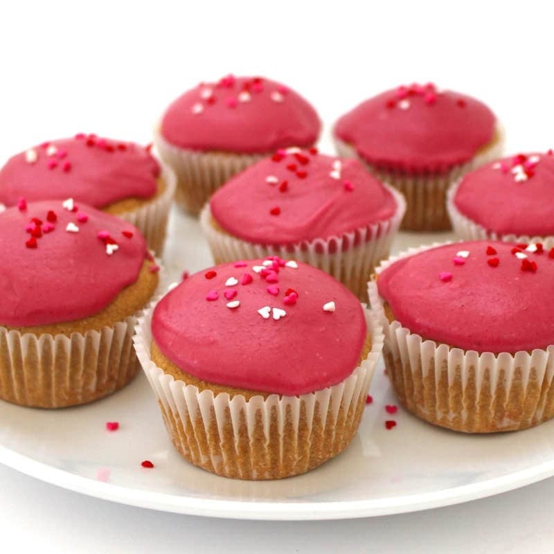 bright pink cupcakes with heart-shaped sprinkles