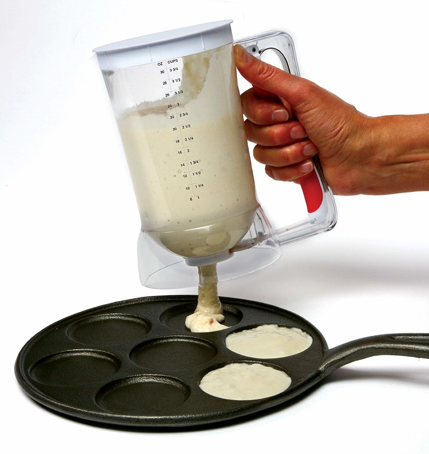 A model using the pancake dispenser to load pancake mix onto a pan