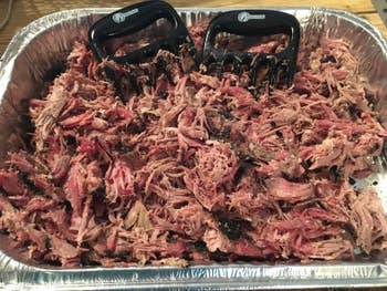 A large pan of shredded meat 