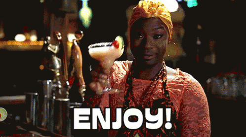 Lafayette from True Blood raising their hand which is holding a margarita cocktail. The caption says "Enjoy."