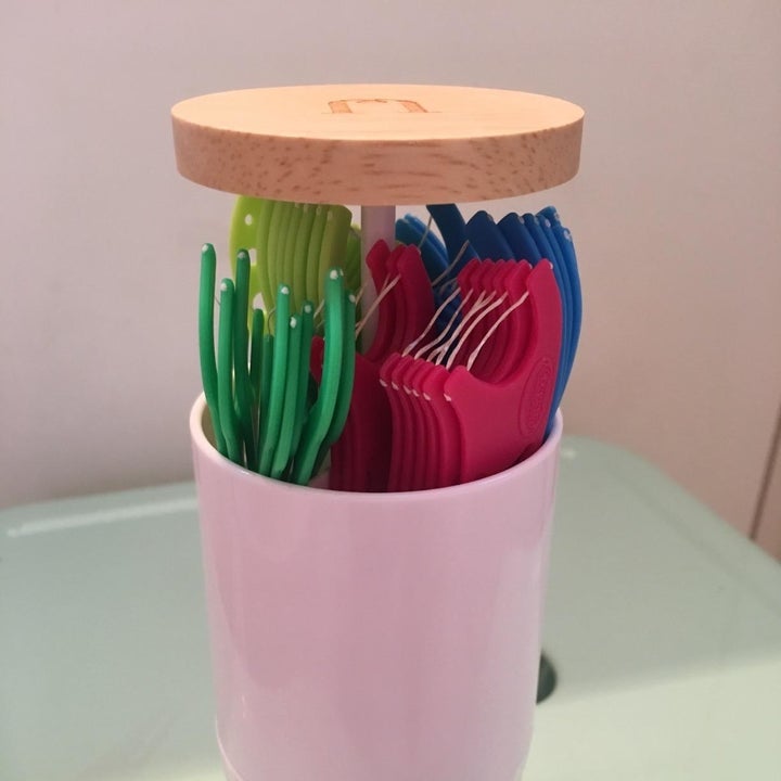 Reviewer photo of dental flossers in the holder