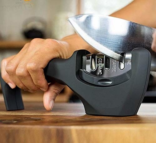 A knife being sharpened using the gadget