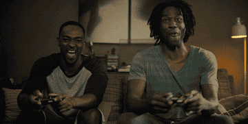 Yahya, in character, playing a video game with Anthony Mackie in &quot;Striking Vipers&quot;