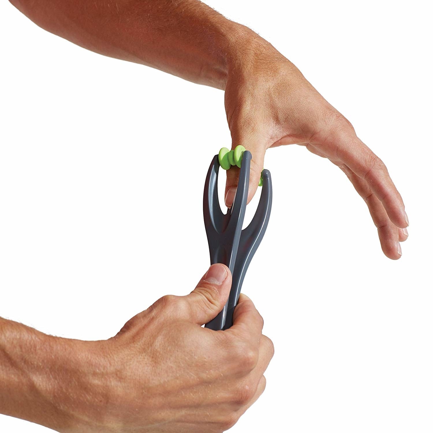 A person rolling the massager across their thumb