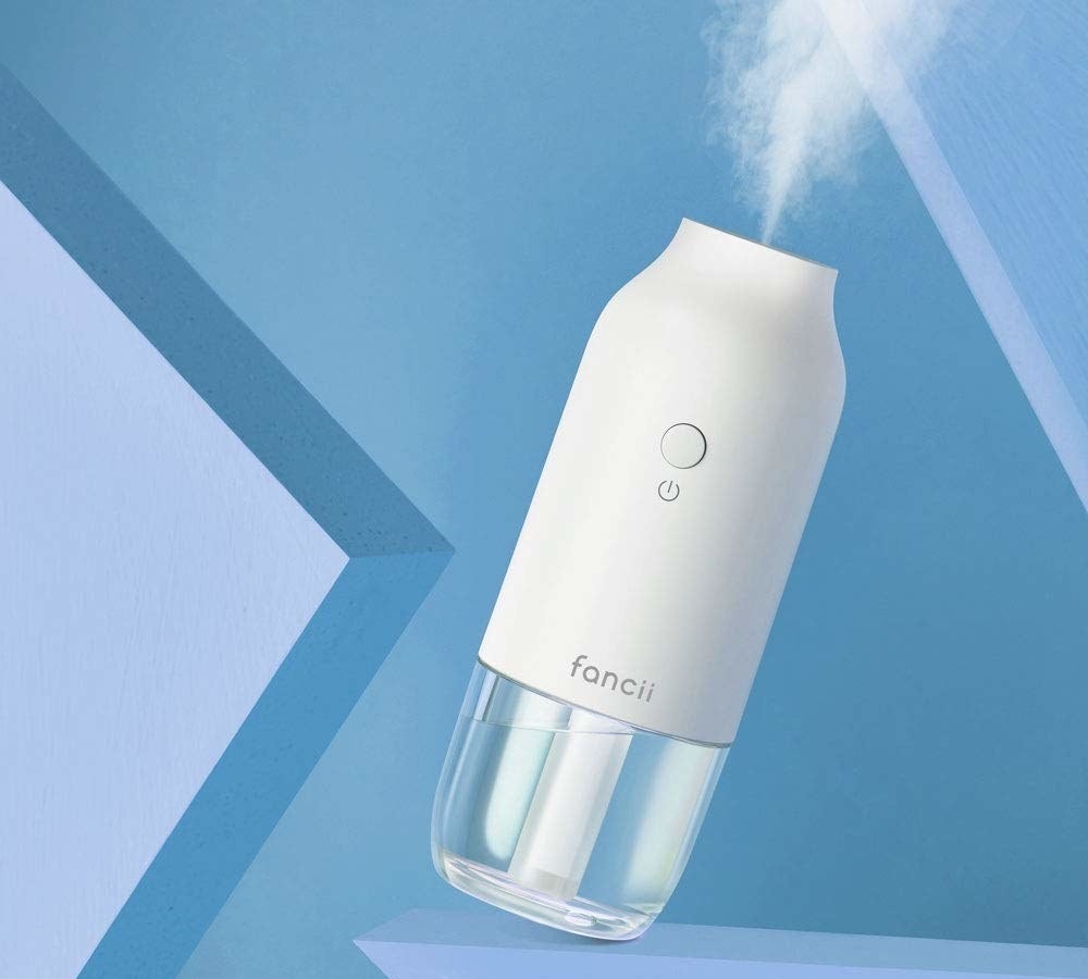 A small humidifier in the shape of a water bottle 