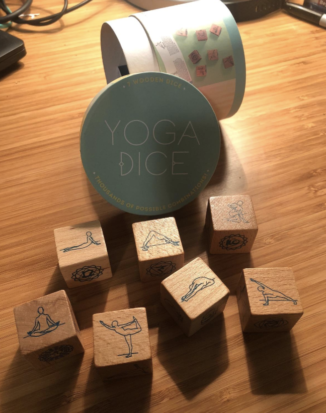 wooden blocks with yoga poses on them