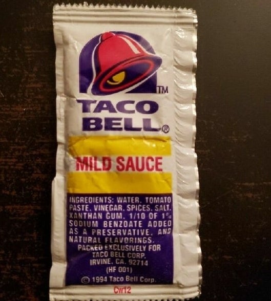 Taco Bell Mild Sauce which came in a white packet with yellow and purple accent colors