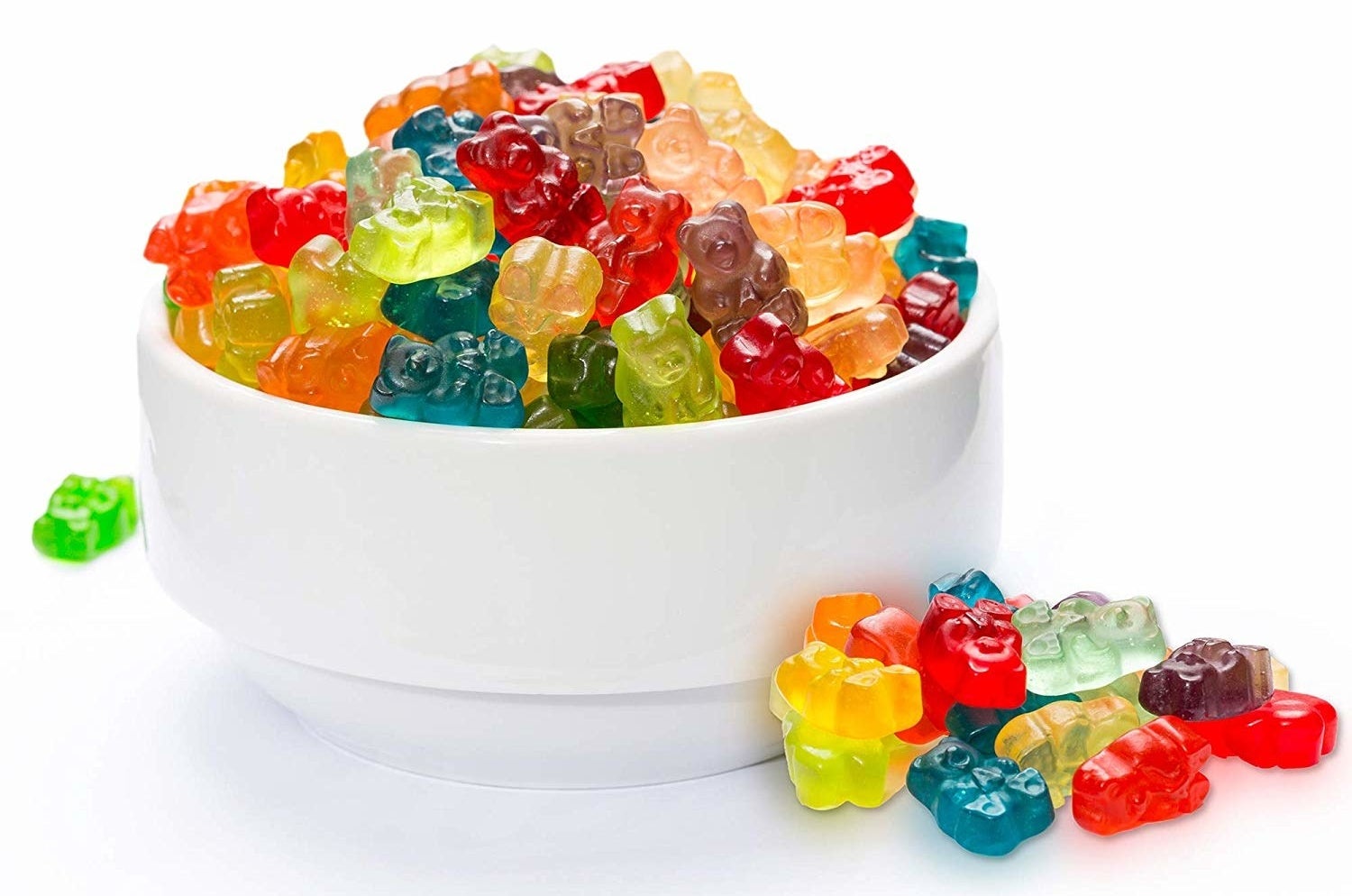 The colorful gummies in a white bowl
