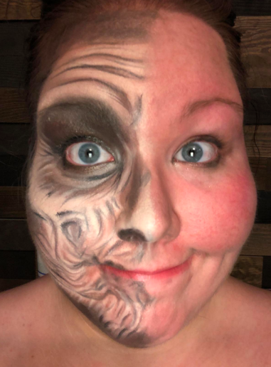 a reviewer&#x27;s face with the left side painted to look like a skeleton and the right side bare