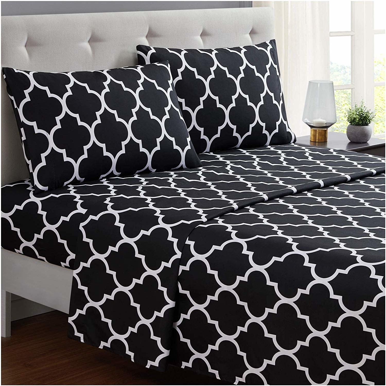 sheets on the bed along with the pillowcases. they&#x27;re white and black.