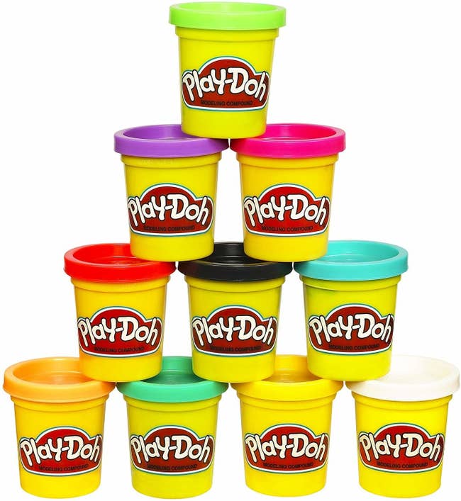 Ten different color containers of Play-Doh stacked in a pyramid