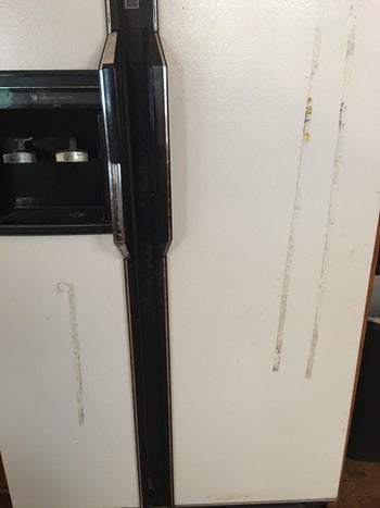 A gooey streak stained on a fridge 