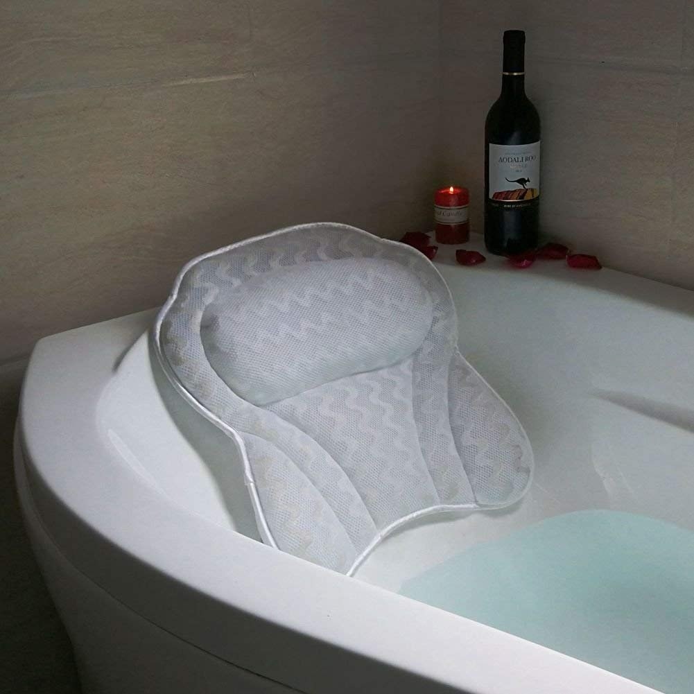 A bath pillow is suctioned onto a bath