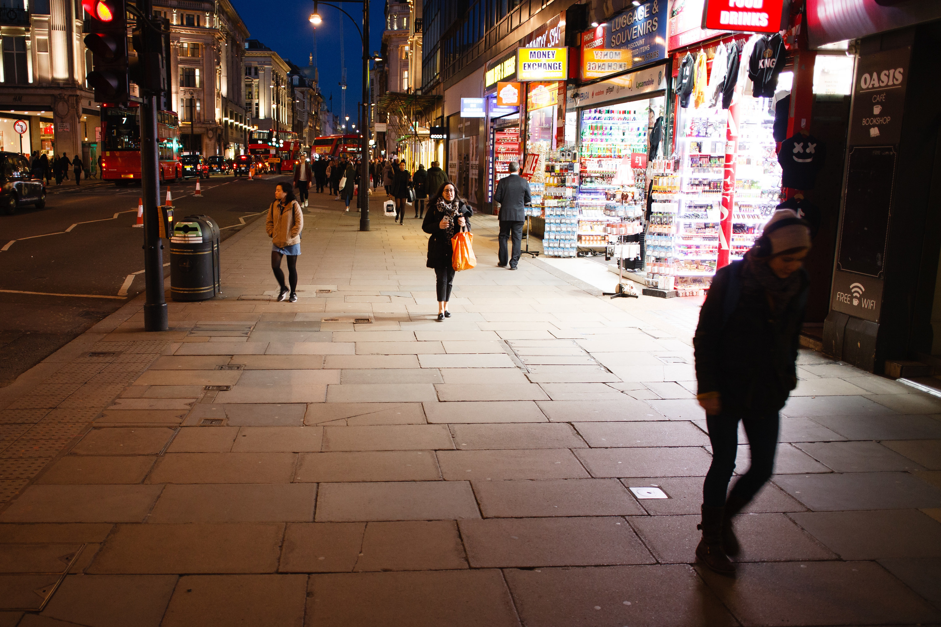 People walk along Oxford Street on March 16.