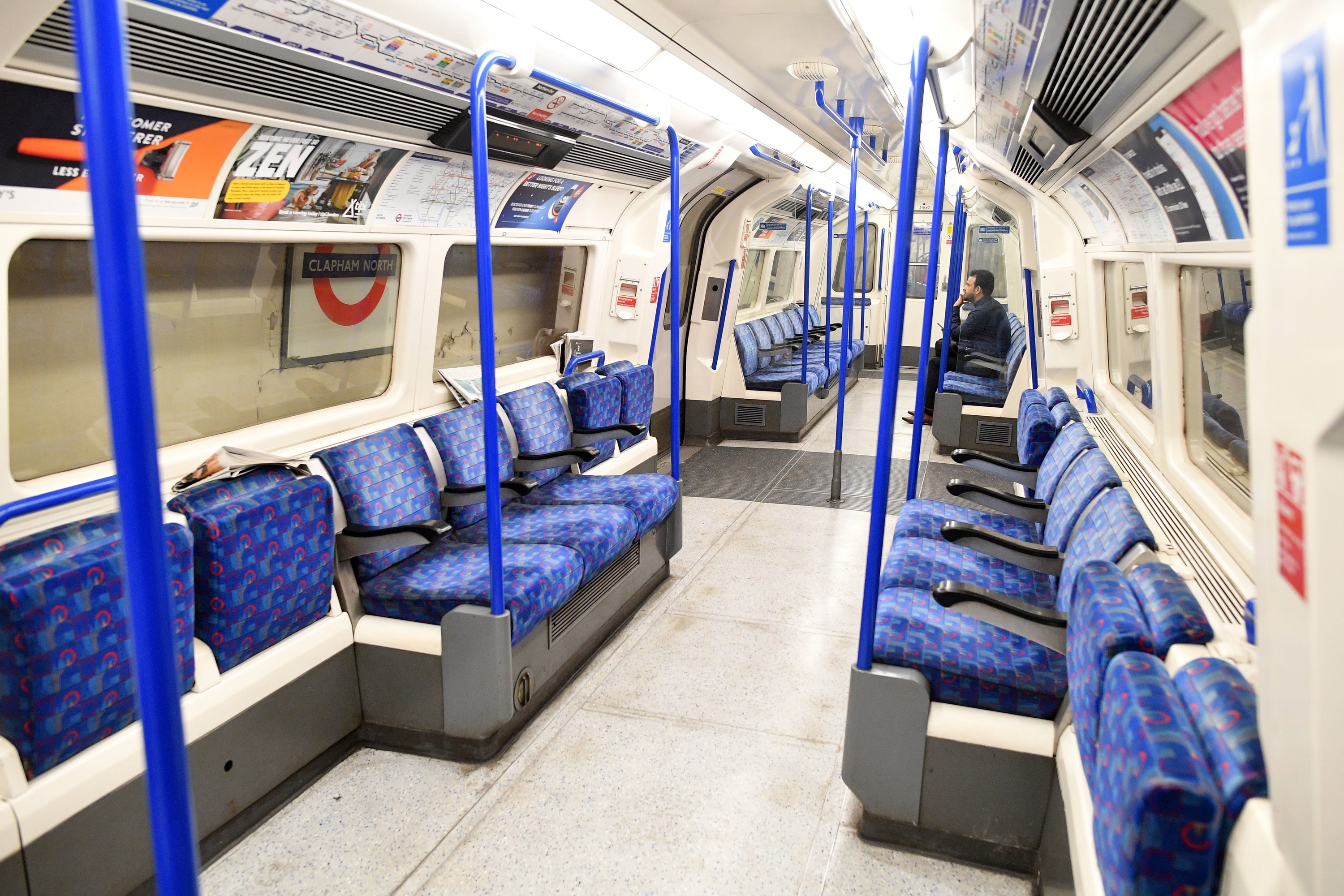 Few commuters travel on the train during the morning rush hour time at 0830 from Clapham North to central London on March 17.