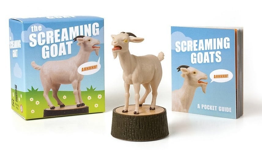A screaming goat on a tree stump