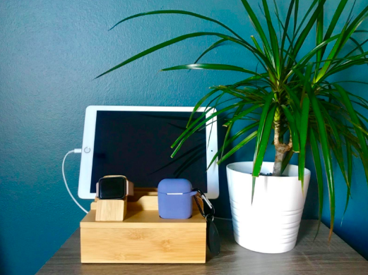Bamboo charging station dock with a tablet and smartwatch
