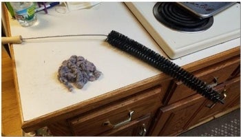 Reviewer photo of dust removed with flexible coil brush