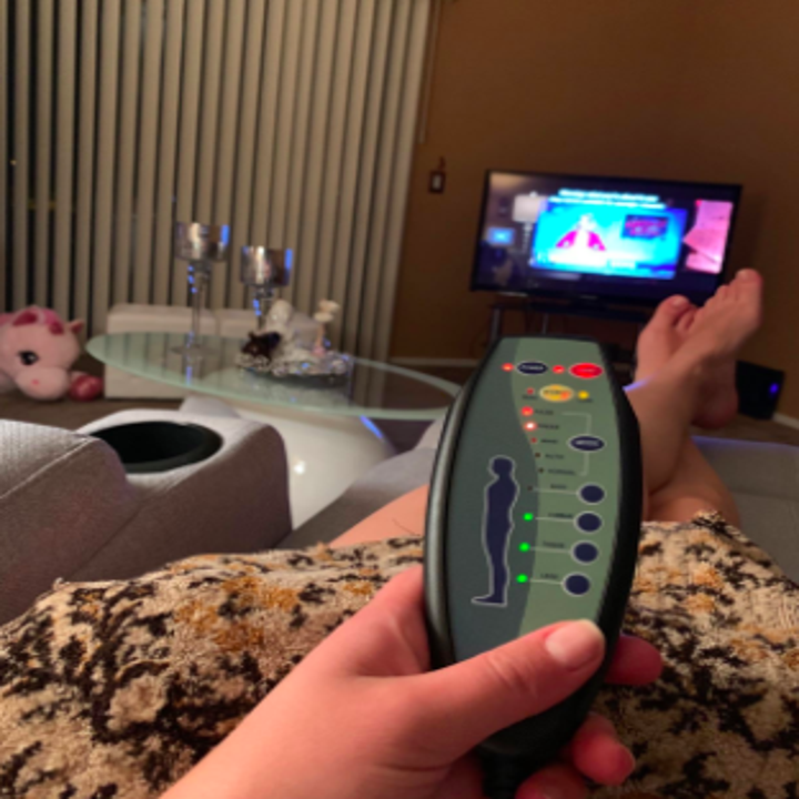 reviewer pic showing remote for the chair's massage modes