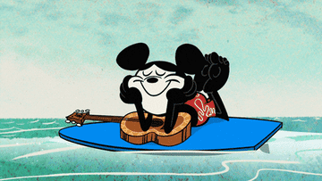 mickey mouse chills on surfboard