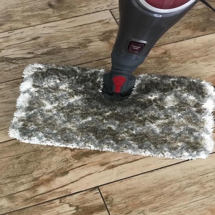 Another reviewer's picture of the steam mop's pad totally covered in dirt 