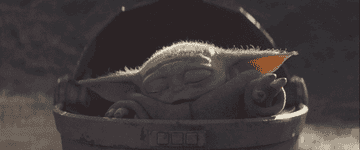 a gif of baby yoda using the force from his carriage