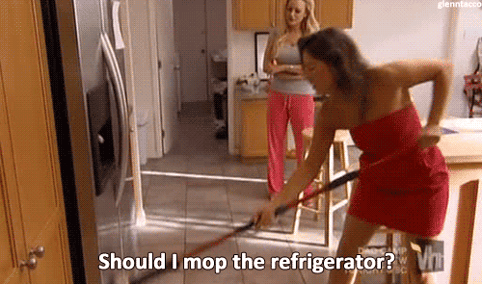 Gif of woman mopping refrigerator
