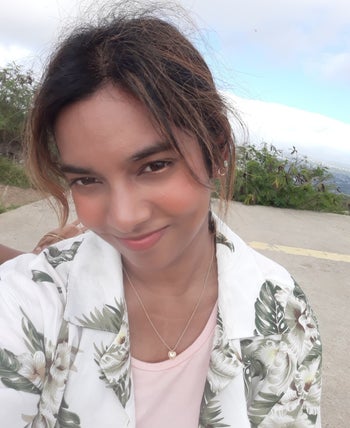 BuzzFeed writer wearing Dawn, an orange shade 