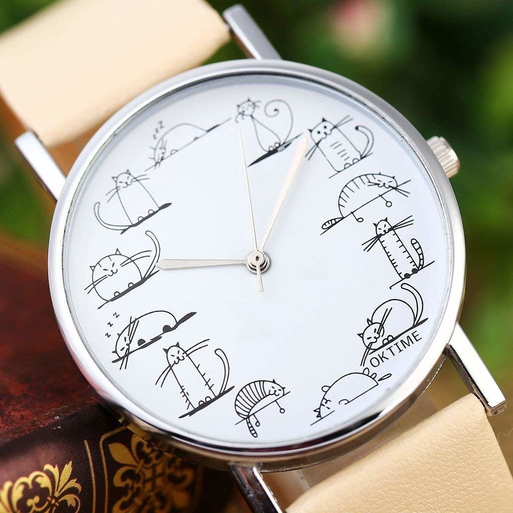 watch with different kitty illustrations in place of numbers on the face, with a tan band