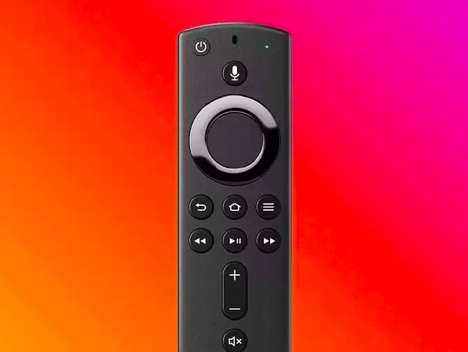 the Amazon Fire TV Stick against an orange and red background