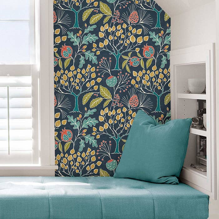 blue wallpaper with a floral design on it