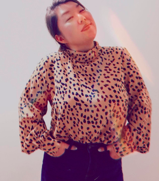 reviewer wearing leopard print top 