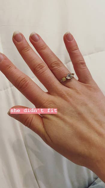 BuzzFeed editor, Emma Lord's hand with a loose ring on one of the fingers and the words 