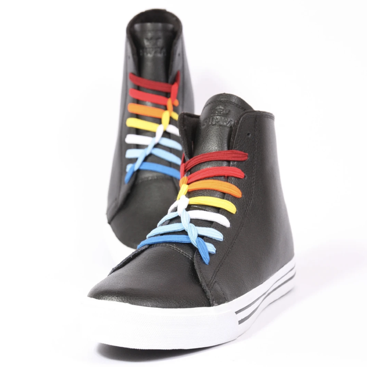 A pair of sneakers with rainbow U-laces 