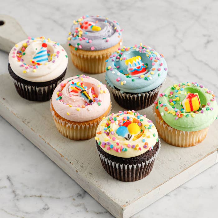 Six cupcakes with sprinkles 