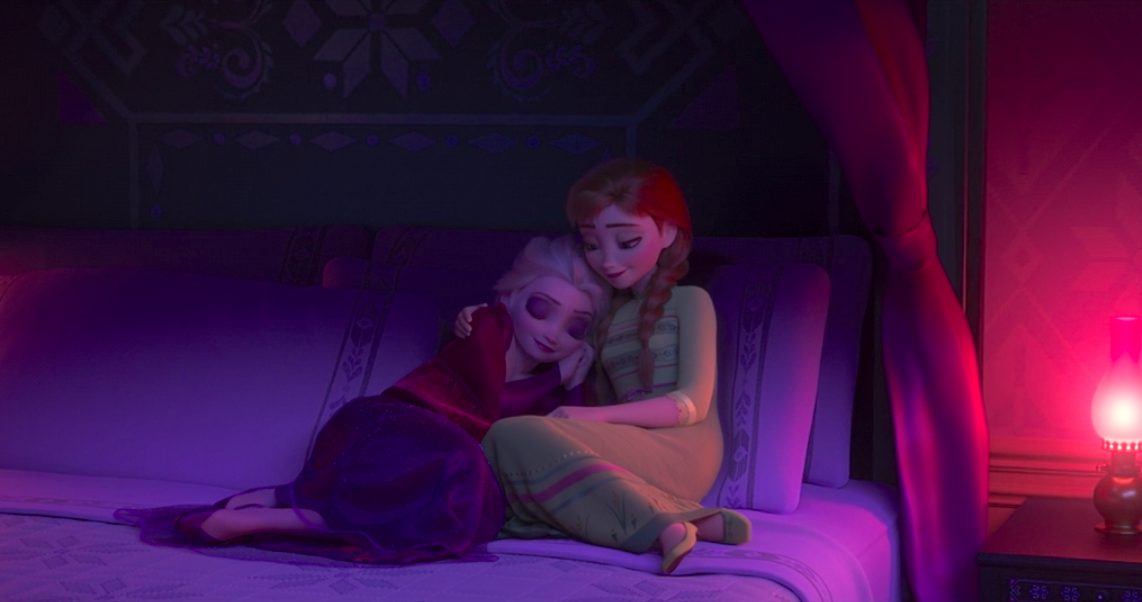 Elsa and Anna curled up in bed with Elsa wearing visible eyeshadow