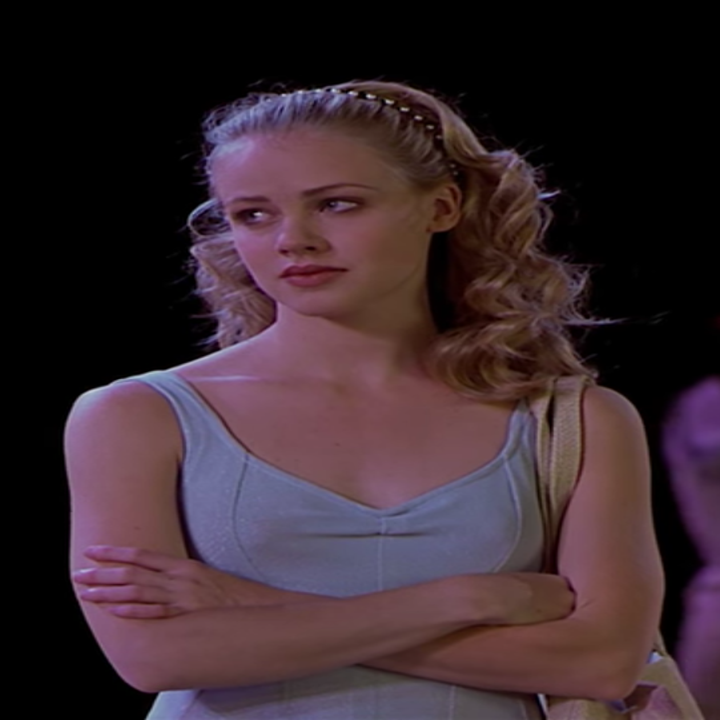 Jody with minimal makeup and curly hair down