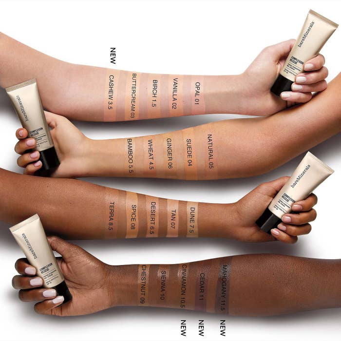 Four models of different skin tones with the sunscreen on their arm
