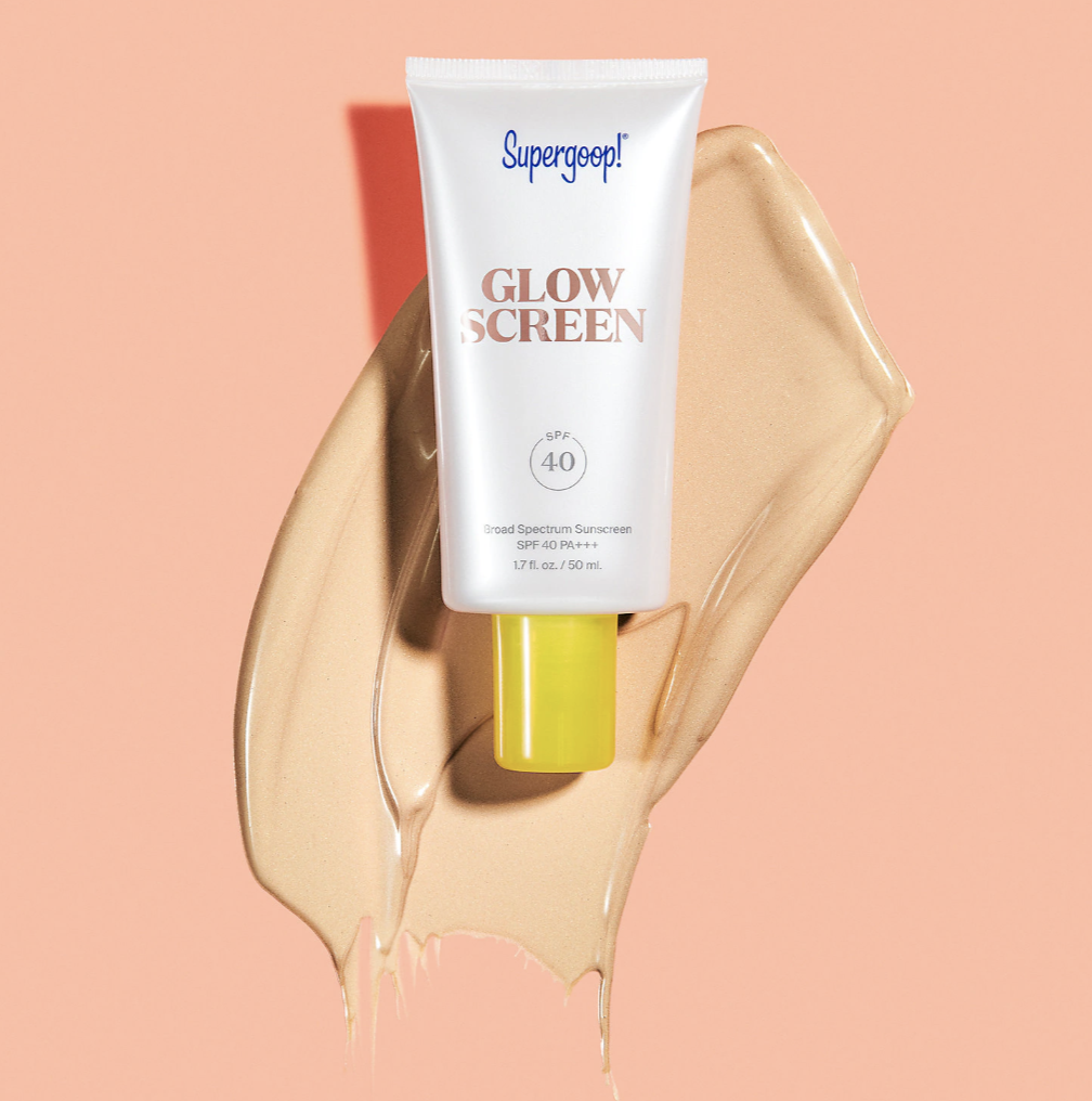 A white tube that says &quot;Supergoop! Glowscreen Sunscreen SPF 40&quot; with a buff-colored formula behind it