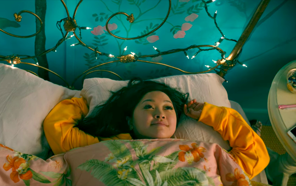 Lara Jean in bed with long, dark eyelashes