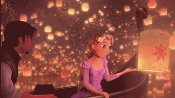 Rapunzel pushing up a lantern from the lake on the boat with Flynn