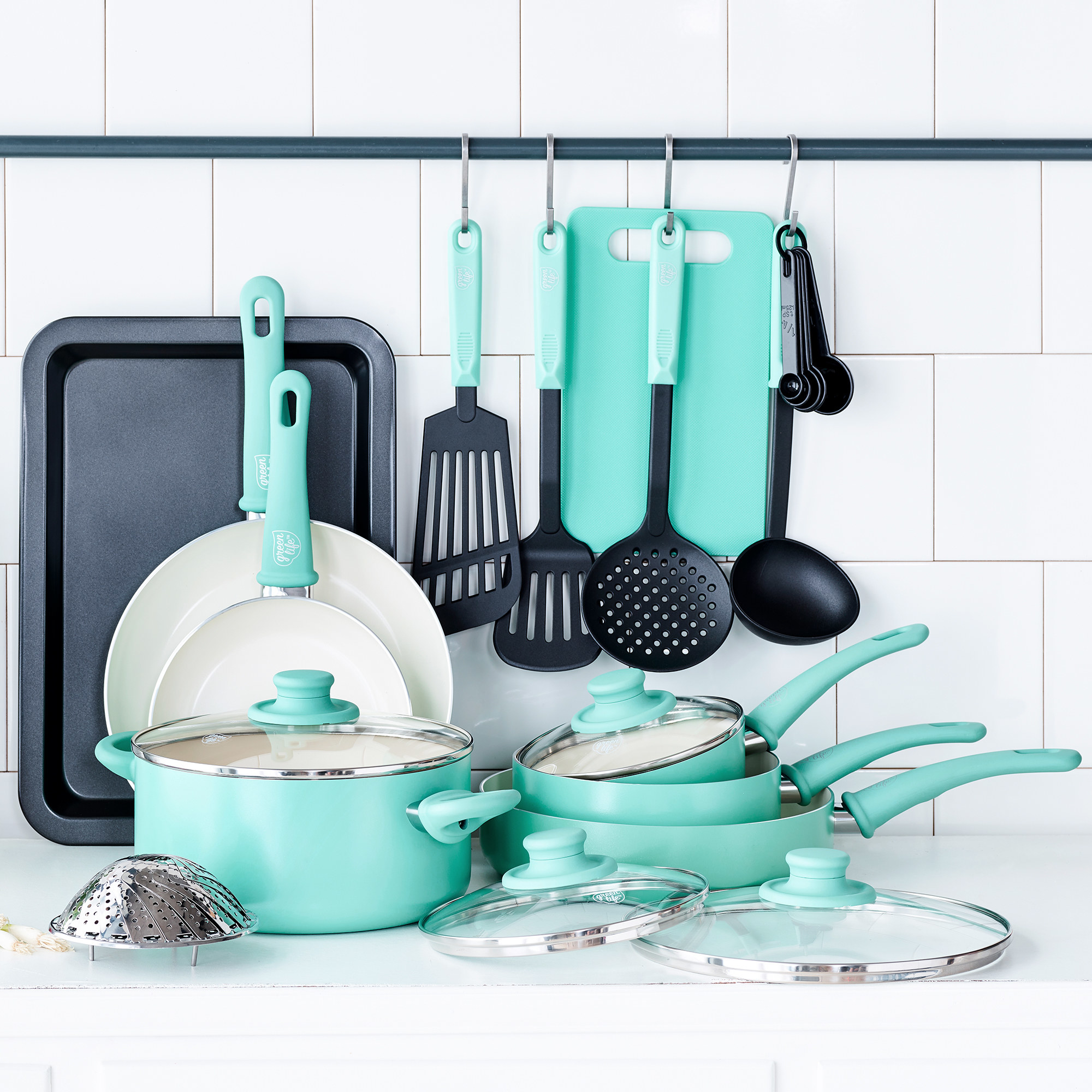 pots, pans, and cooking utensils in a light turquoise color