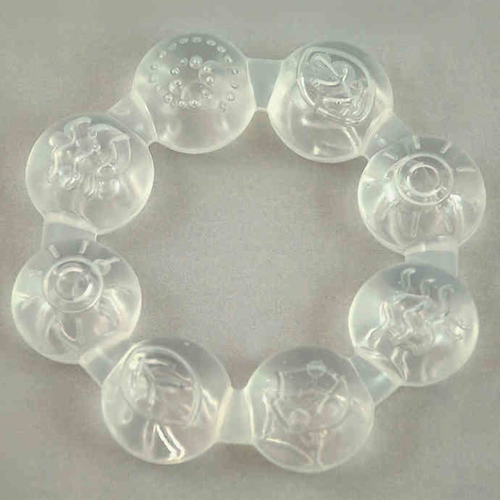 a clear teether with little circles that make up a ring