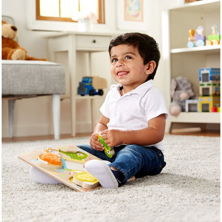 a child playing with the puzzle
