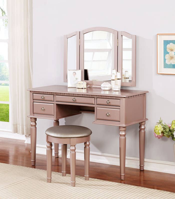 the rose gold vanity with open mirror and matching stool