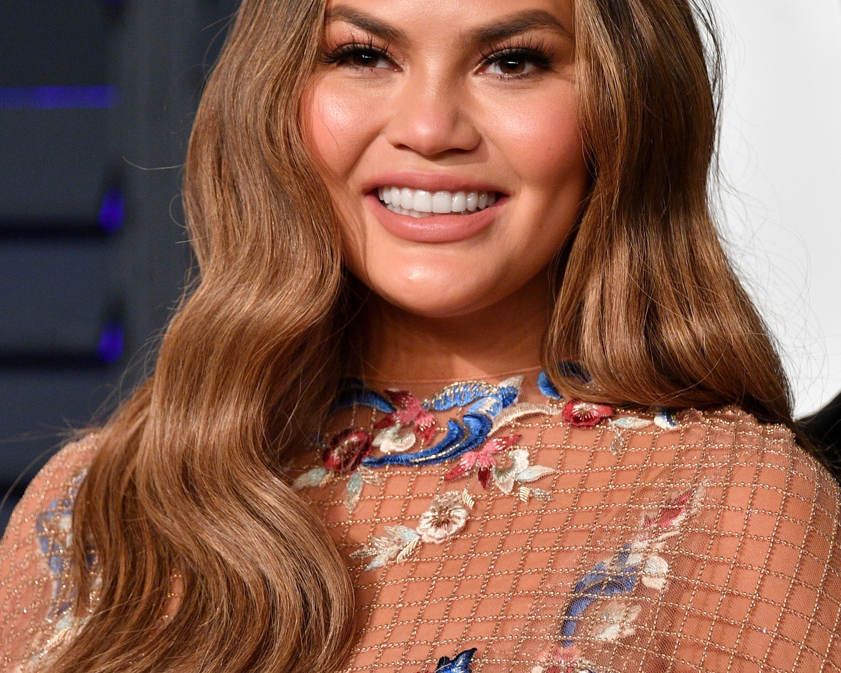 Chrissy Teigen Revealed She Worries Over Her Breast Implants Now She's A  Parent