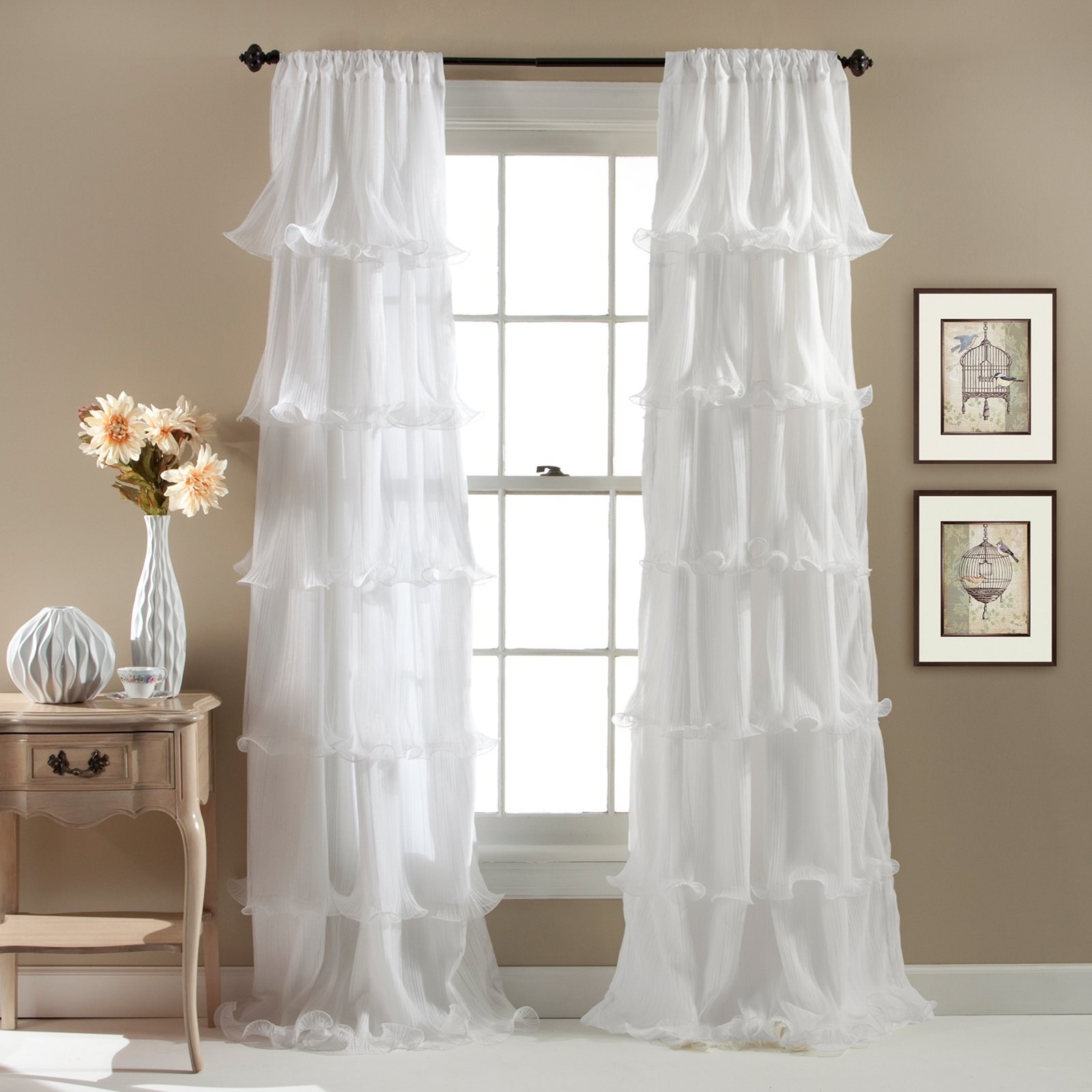 the white ruffle curtains over windows