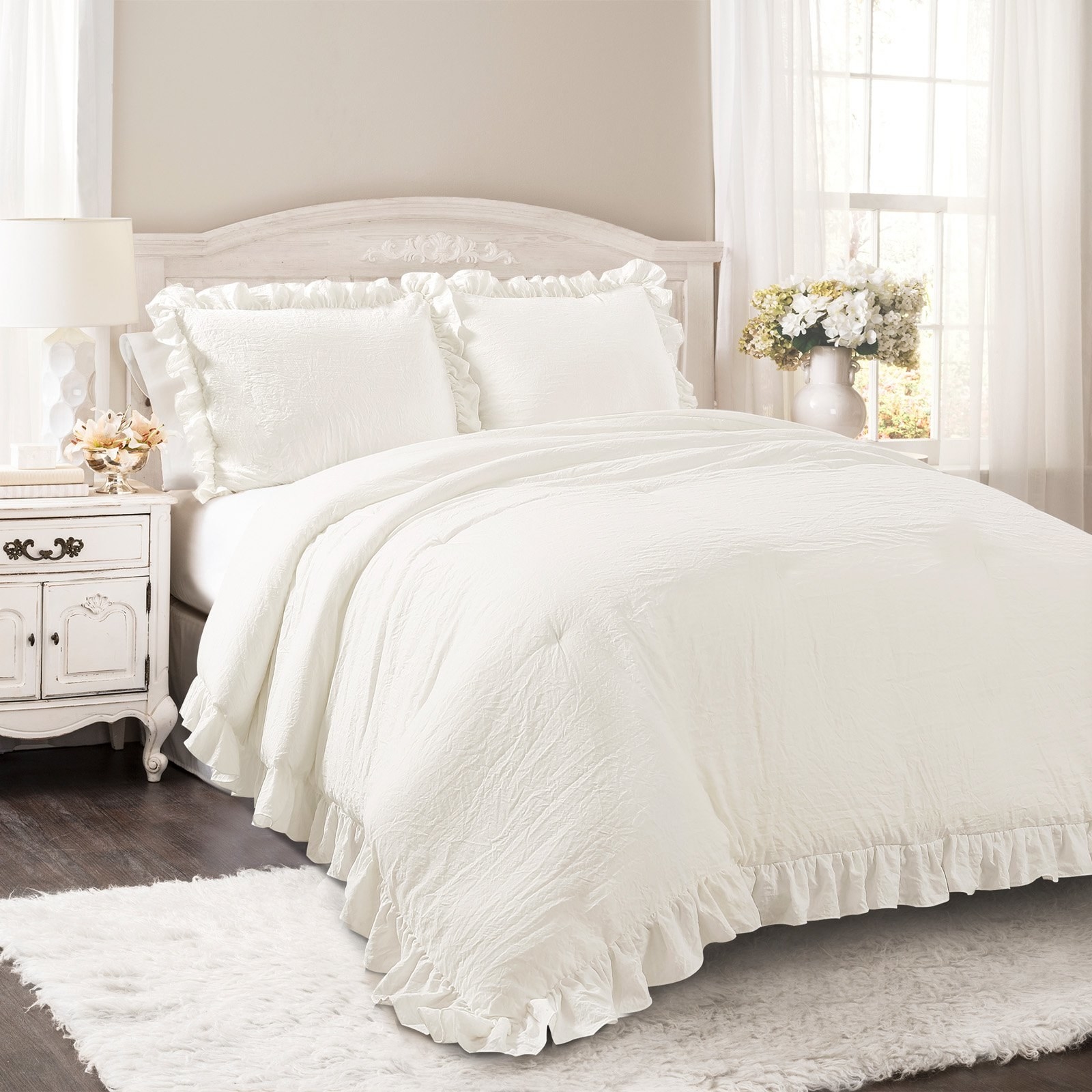 the white bedding set on a bed